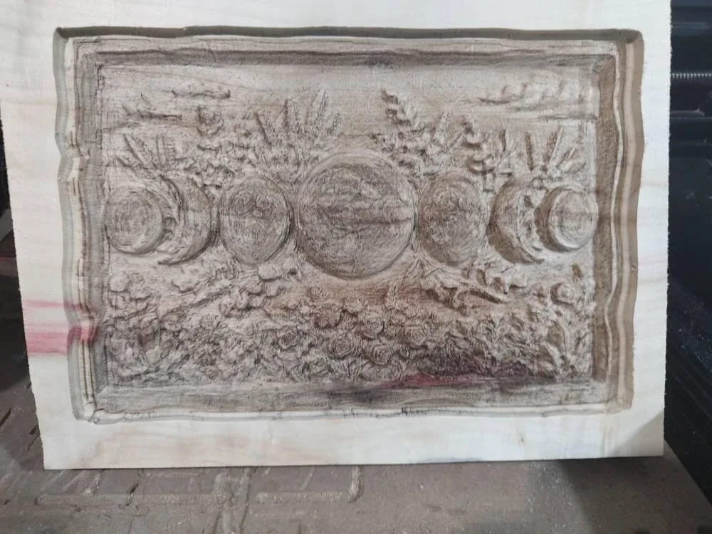 The finished panel after burning, carved relief with the laser burn applied